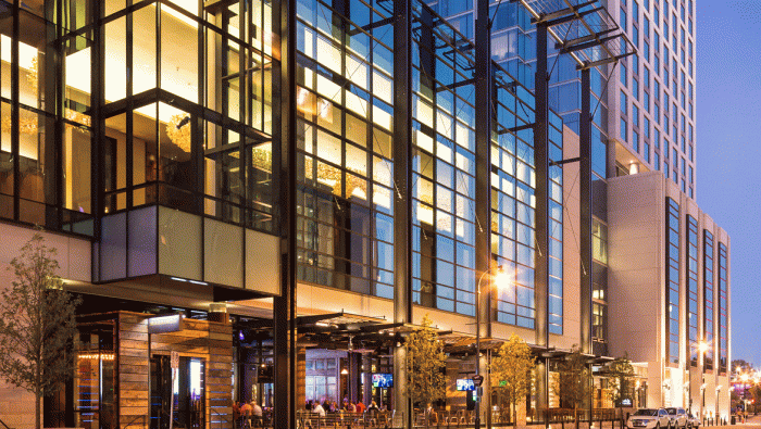 Omni Nashville Hotel exterior with city skyline view