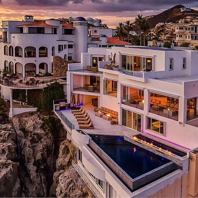 Private Cabo San Lucas villa with infinity pool at golden hour overlooking the Pacific Ocean